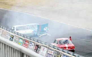 Queensland driver Bob Heagerty (7) suffers damage to his car at Morgan Park Raceway yesterday. Queensland driver Bob Heagerty (7) suffers damage to his car at Morgan Park Raceway yesterday.